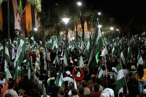 Local residents hold flags