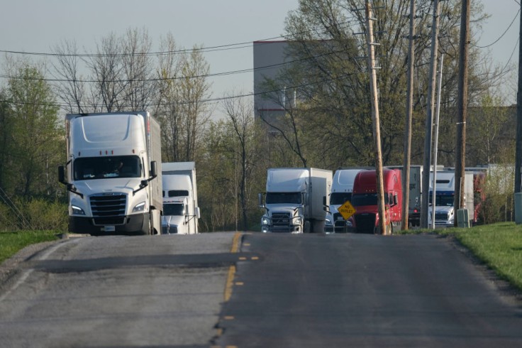 Semi-trucks are parked outside a FedEx facility in Indianapolis