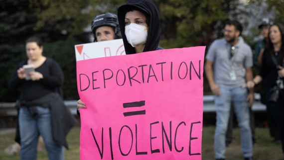 Demonstrators protest outside of an immigrant processing and detention center.
