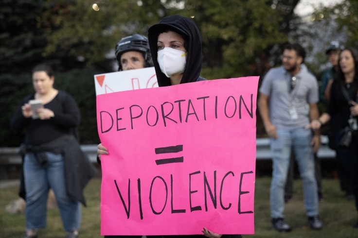 Demonstrators protest outside of an immigrant processing and detention center.