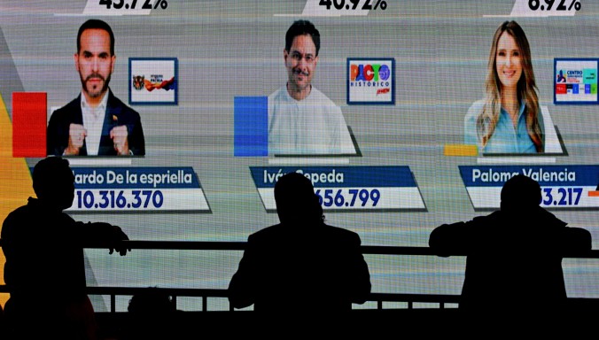 A screen shows the first exit poll results.