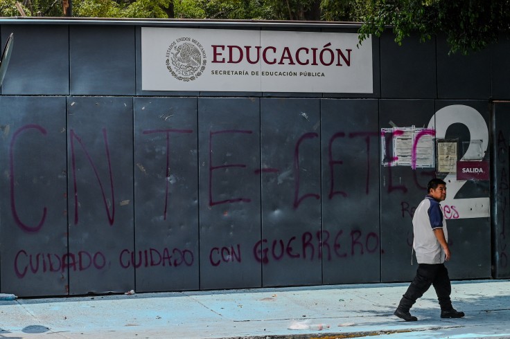 A man walks in front of the Ministry of Education