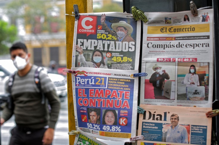 A man walks near Peruvian newspapers at Lima Peru