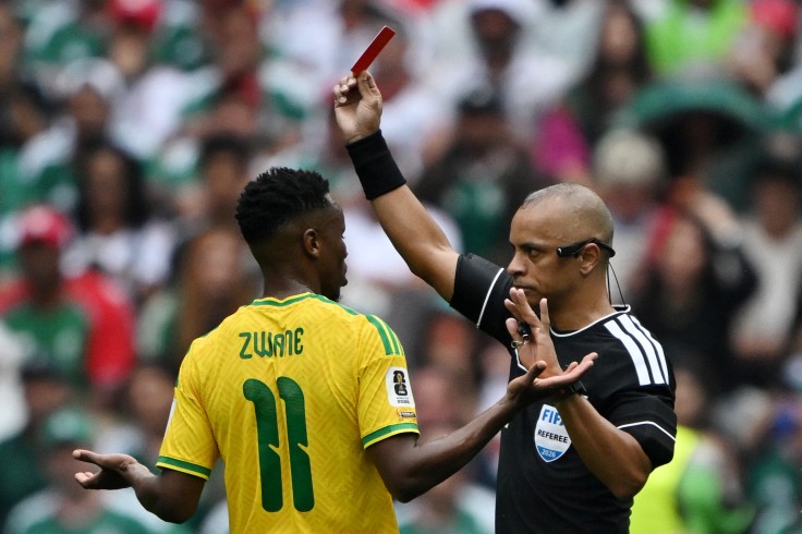 Brazilian referee Wilton Sampaio shows a red card.