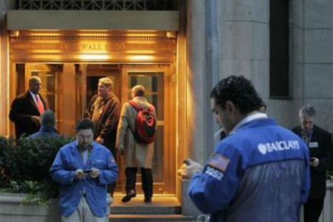 Wall Street ends flat, tech shares dip after Sandy shutdown