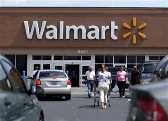 Wal-Mart sales under global pressure, shares down