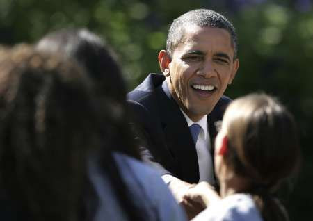 U.S. President Barack Obama shakes hands at a reception for the Texas A&M 2011 NCAA women's basketball championship team at the White House in Washington, October 6, 2011.